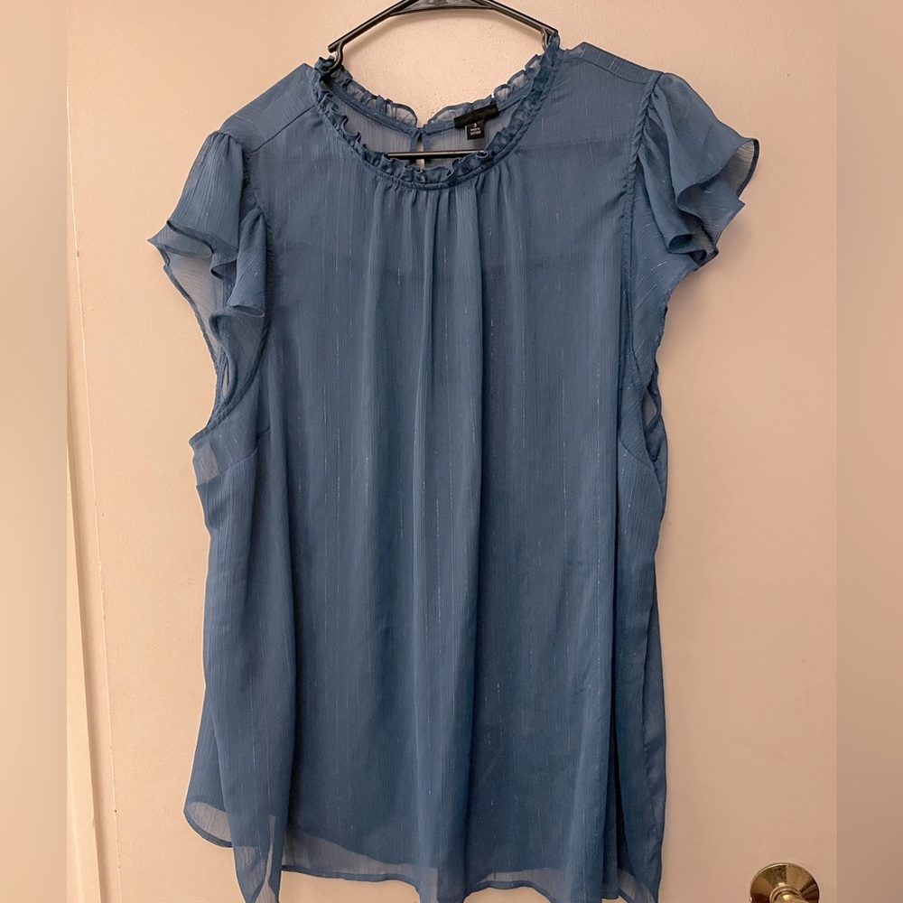 Sheer blue top with silver thougout